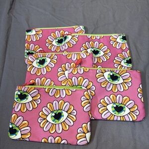 Set of five pink ipsy bags with flowers, neon colors, eyeball, funky pattern